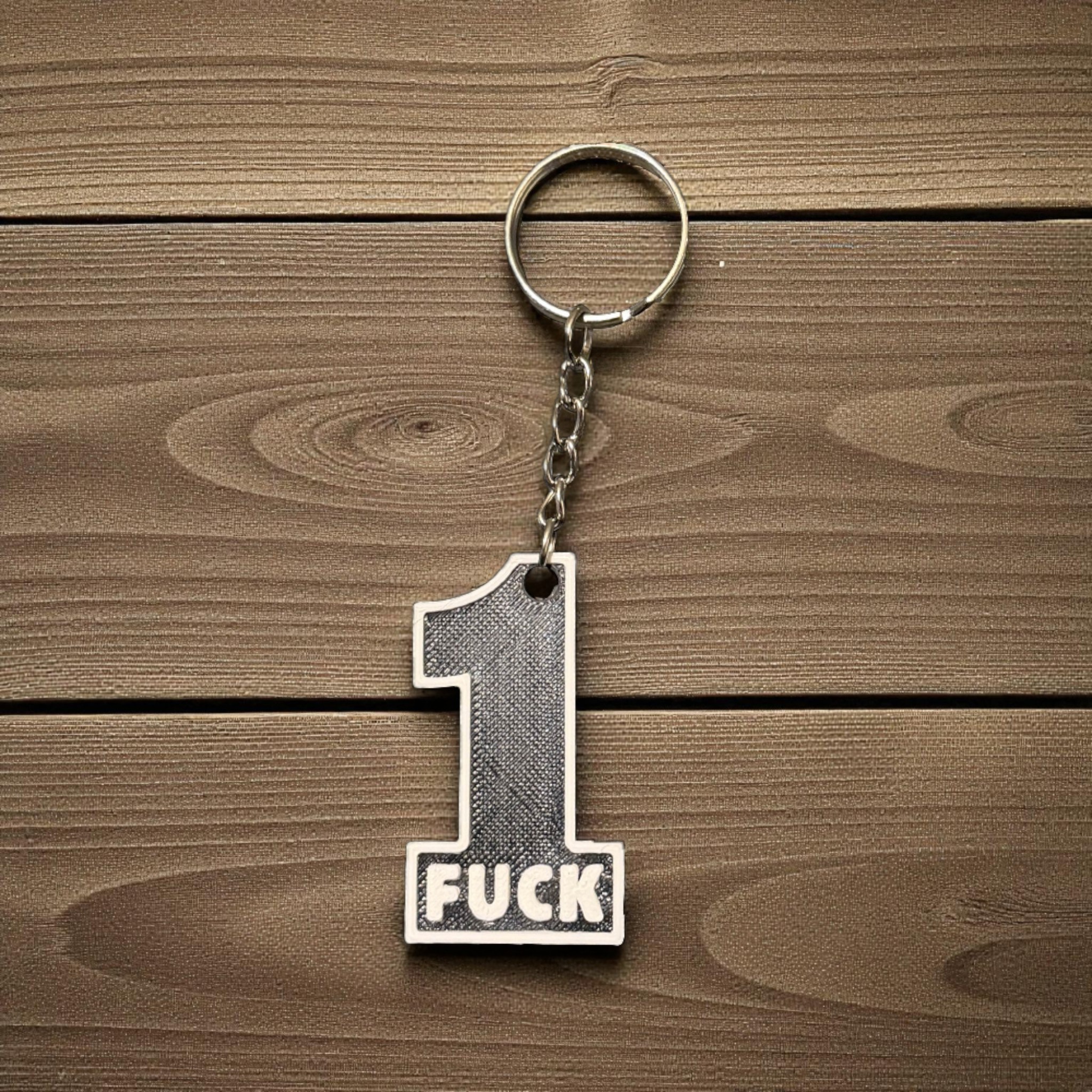 3D printed number one keychain with adult wording
